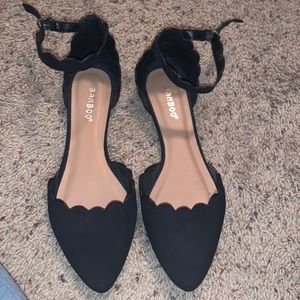 Black suede flats with strap around ankle